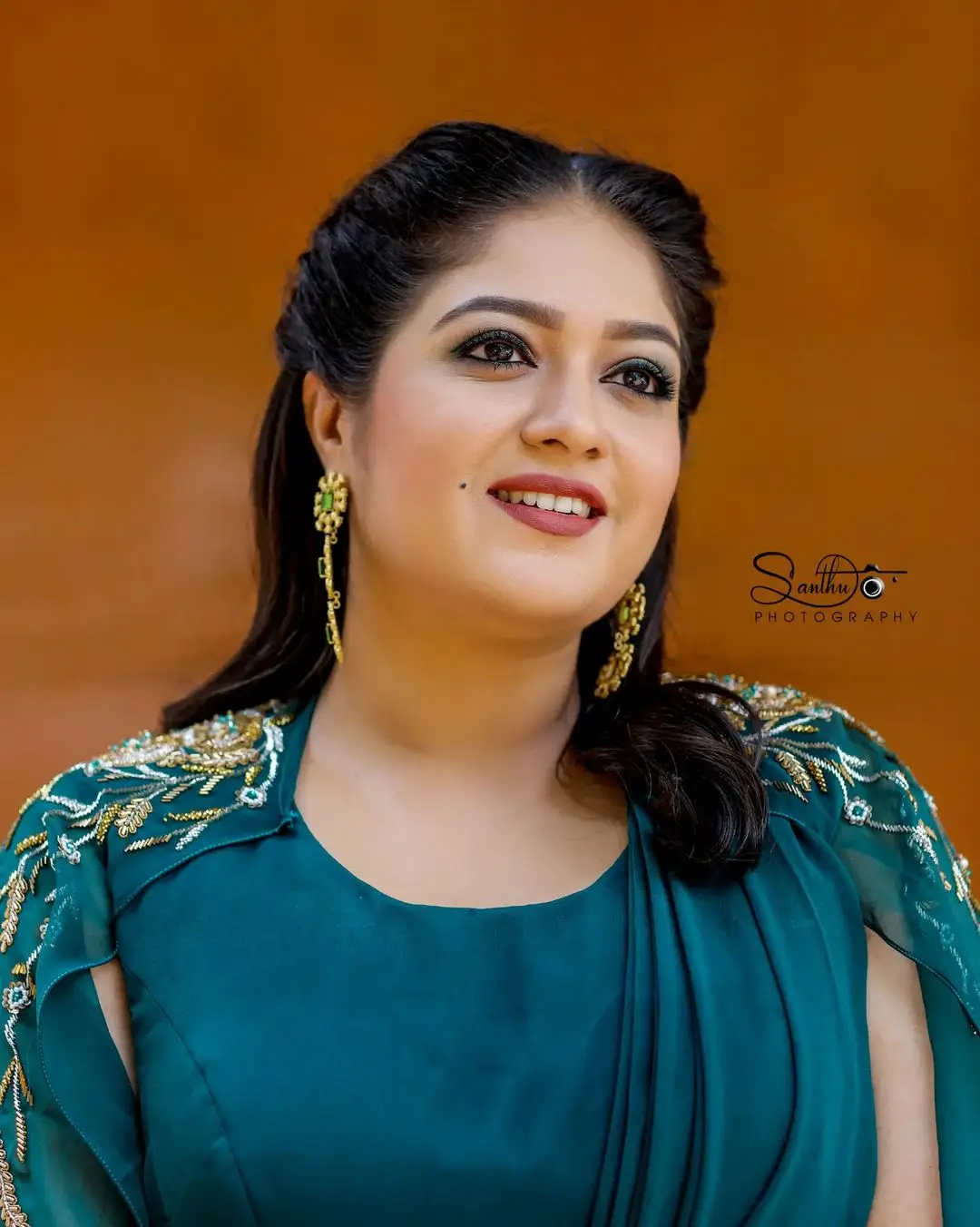 Meghana Raj Wearing Beautiful Earring Blue Gown